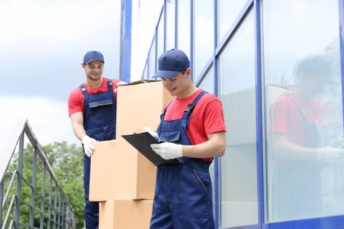 Movers handling boxes safely during a London relocation job