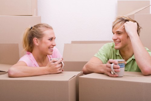 Team managing furniture removals in London through a narrow staircase
