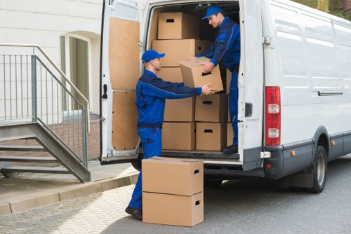 Professional movers carrying furniture in London