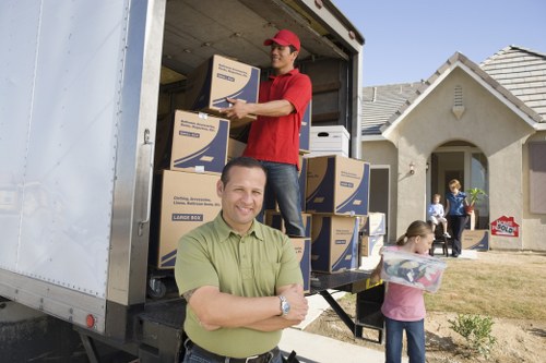 A moving team planning a city relocation with a removal van