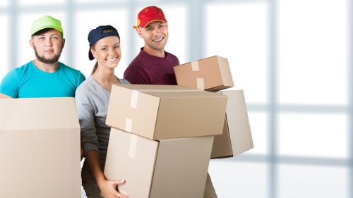 Supervisor reviewing safety procedures with moving staff