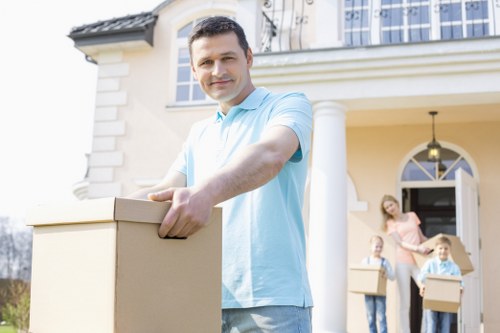 Movers loading furniture into a removal van