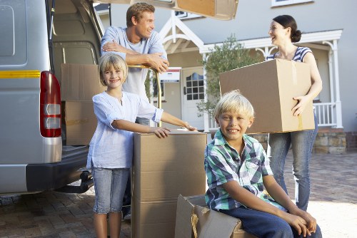 Office movers transporting business furniture through London streets