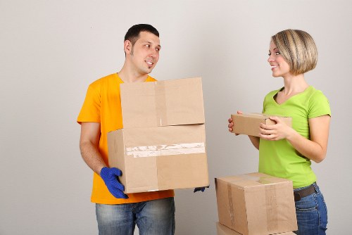 Office relocation team loading equipment into a van in London