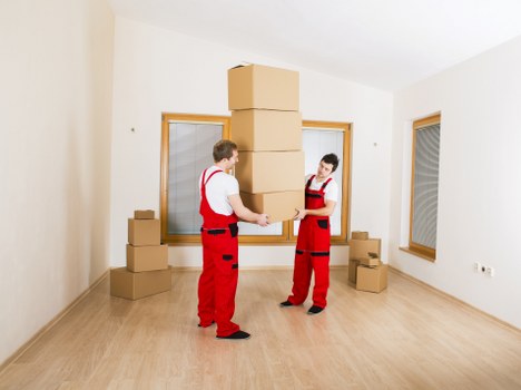 Residential same day removal with movers carrying furniture