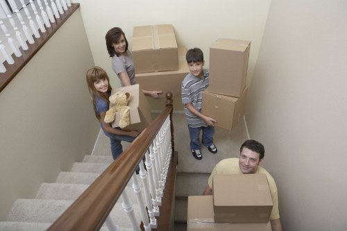 Removal team carrying items through a doorway